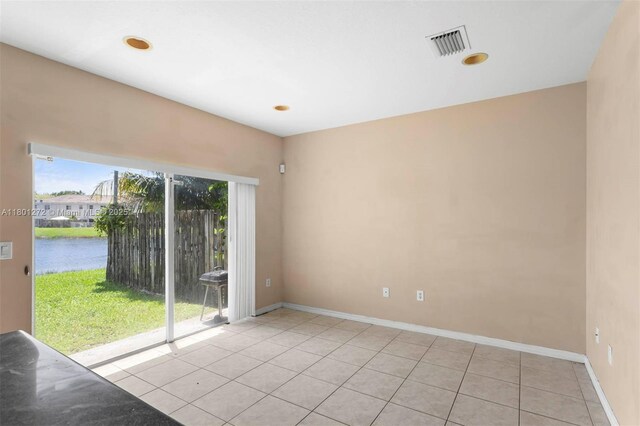 2946 SE 15th Ter, Homestead, FL 33035 - unfurnished room with light tile patterned flooring, a water view, baseboards, and recessed lighting