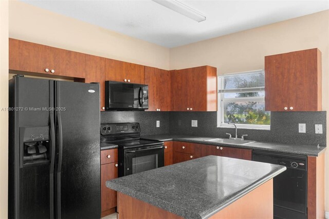 2946 SE 15th Ter, Homestead, FL 33035 - kitchen with black appliances, a sink, dark countertops, and backsplash