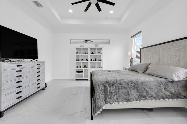 1020 Rush Ave, Lehigh Acres, FL 33972 - bedroom featuring light marble finish flooring, a raised ceiling, baseboards, a ceiling fan, and recessed lighting