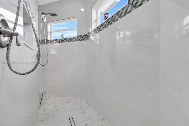 1020 Rush Ave, Lehigh Acres, FL 33972 - full bathroom with healthy amount of natural light and a tile shower
