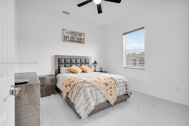 1020 Rush Ave, Lehigh Acres, FL 33972 - bedroom with marble look tiles and ceiling fan