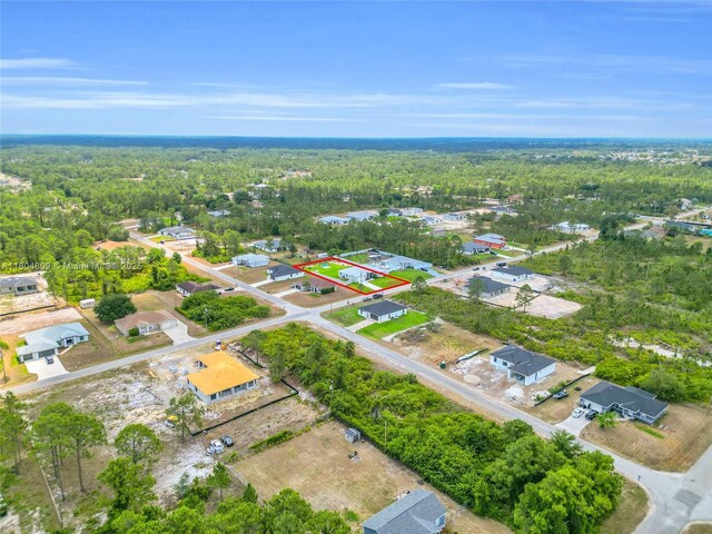 1020 Rush Ave, Lehigh Acres, FL 33972 - aerial view of property's location with a forest