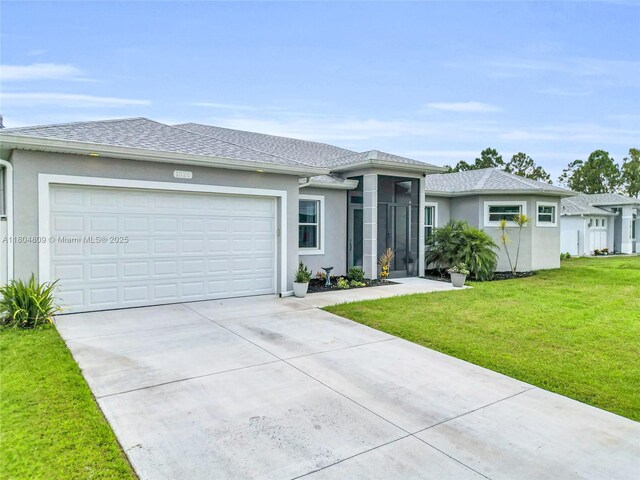 1020 Rush Ave, Lehigh Acres, FL 33972 - view of front of house with concrete driveway, an attached garage, a front yard, and stucco siding