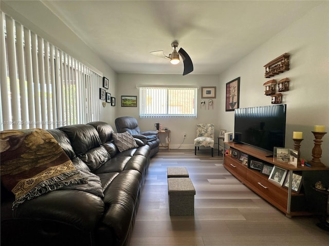 14367 SW 96th Ln, Miami, FL 33186 - living room featuring a ceiling fan, wood finished floors, and baseboards