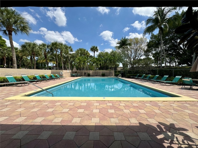 14367 SW 96th Ln, Miami, FL 33186 - community pool featuring a patio and fence
