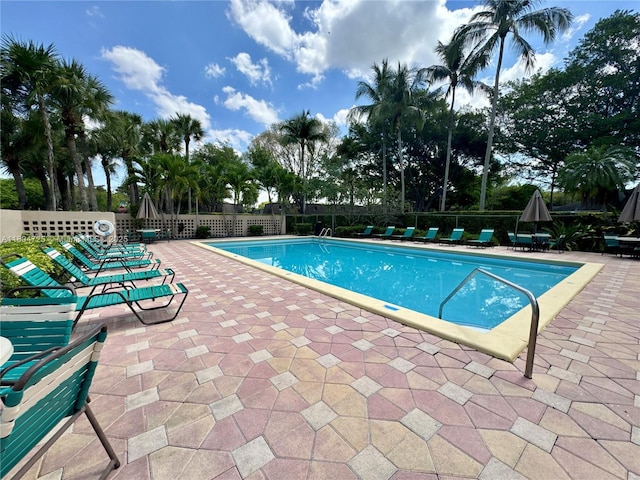 14367 SW 96th Ln, Miami, FL 33186 - community pool with a patio area and fence