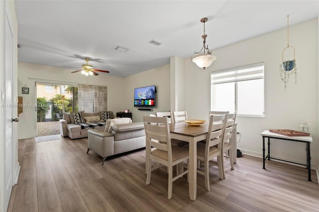 922 SW 148th Pl, Miami, FL 33194 - dining area featuring wood finished floors, a ceiling fan, and baseboards