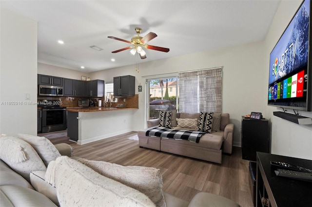 922 SW 148th Pl, Miami, FL 33194 - living area featuring ceiling fan, wood finished floors, recessed lighting, and baseboards
