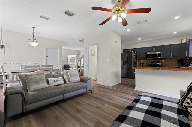 922 SW 148th Pl, Miami, FL 33194 - living area featuring a ceiling fan, wood finished floors, baseboards, and recessed lighting