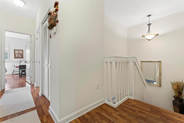 922 SW 148th Pl, Miami, FL 33194 - corridor with wood finished floors, an upstairs landing, and baseboards