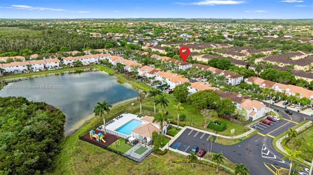 922 SW 148th Pl, Miami, FL 33194 - aerial view of property's location featuring a pool area, a large body of water, and nearby suburban area