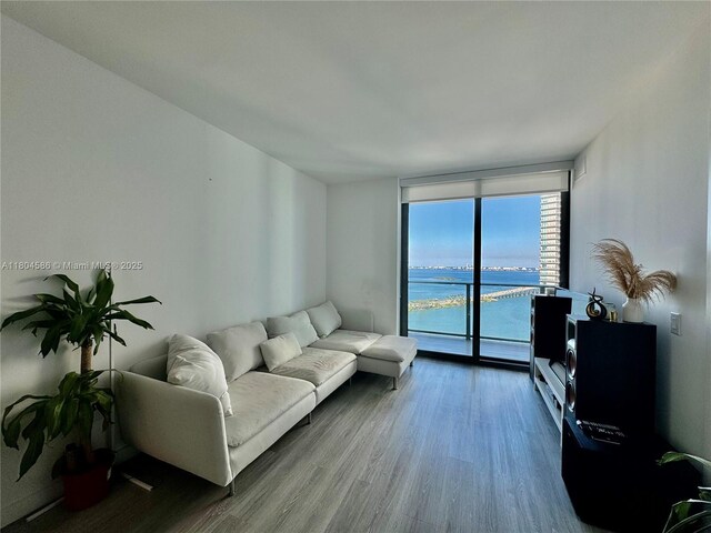 501 NE 31st St Unit 2903, Miami, FL 33137 - living room with a wall of windows and wood finished floors