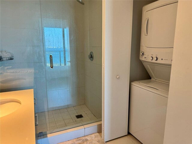 501 NE 31st St Unit 2903, Miami, FL 33137 - bathroom with stacked washer and clothes dryer, a shower stall, and a sink