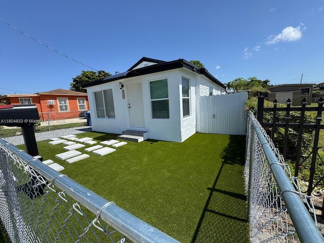 1794 NW 74th Ter, Miami, FL 33147 - rear view of house with stucco siding