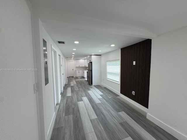 1794 NW 74th Ter, Miami, FL 33147 - unfurnished living room featuring baseboards, wood finished floors, and recessed lighting