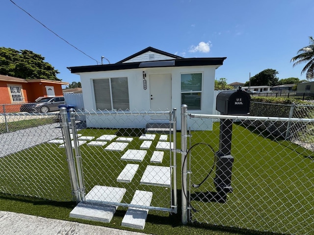 1794 NW 74th Ter, Miami, FL 33147 - bungalow-style house with a gate and stucco siding