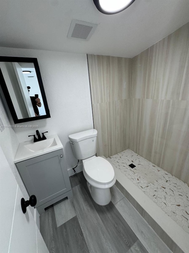 1794 NW 74th Ter, Miami, FL 33147 - bathroom with curtained shower, vanity, toilet, and wood finished floors