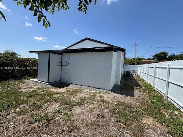 1794 NW 74th Ter, Miami, FL 33147 - view of side of home featuring a fenced backyard and central AC unit