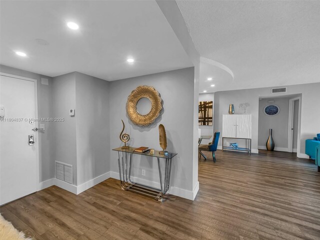 3800 Hillcrest Dr Unit 907, Hollywood, FL 33021 - corridor featuring baseboards, wood finished floors, and recessed lighting