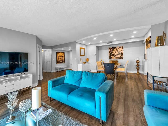 3800 Hillcrest Dr Unit 907, Hollywood, FL 33021 - living room featuring a textured ceiling, wood finished floors, baseboards, and recessed lighting