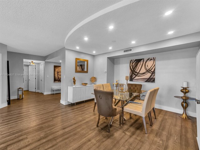 3800 Hillcrest Dr Unit 907, Hollywood, FL 33021 - dining room featuring a textured ceiling, baseboards, wood finished floors, and recessed lighting