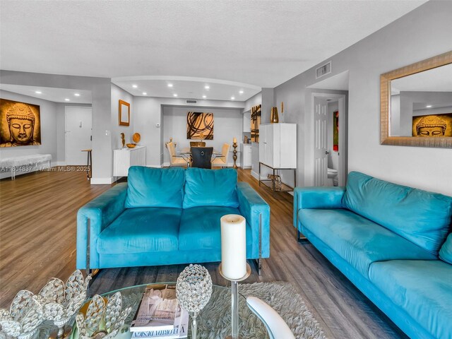 3800 Hillcrest Dr Unit 907, Hollywood, FL 33021 - living area featuring wood finished floors, recessed lighting, and a textured ceiling