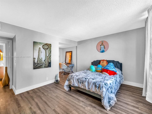 3800 Hillcrest Dr Unit 907, Hollywood, FL 33021 - bedroom featuring wood finished floors, baseboards, and a textured ceiling