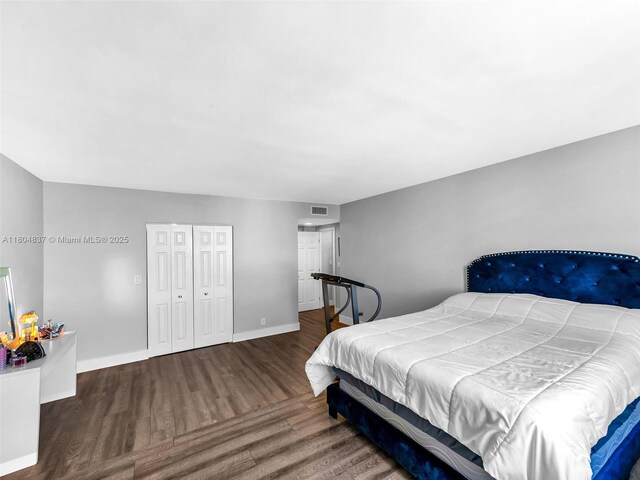 3800 Hillcrest Dr Unit 907, Hollywood, FL 33021 - bedroom with wood finished floors, baseboards, and a closet
