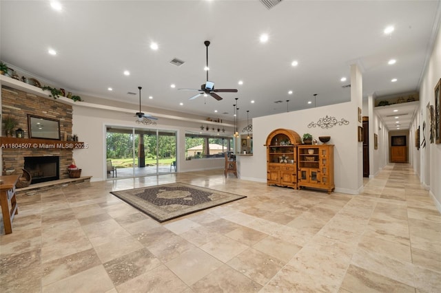 3324 Miller Ave, Lake Placid, FL 33852 - living room with a stone fireplace, ceiling fan, recessed lighting, crown molding, and baseboards