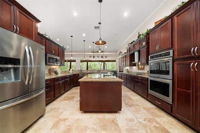 3324 Miller Ave, Lake Placid, FL 33852 - kitchen featuring stainless steel appliances, light stone counters, a kitchen island with sink, recessed lighting, and crown molding