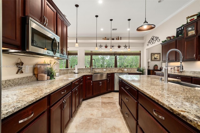 3324 Miller Ave, Lake Placid, FL 33852 - kitchen with a sink, stainless steel appliances, plenty of natural light, decorative light fixtures, and crown molding