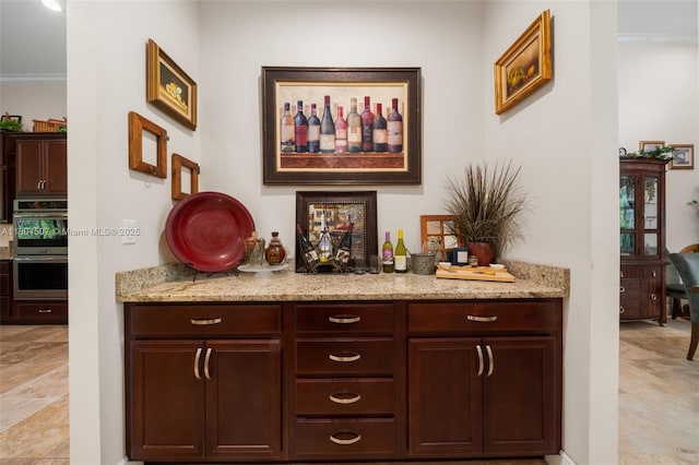 3324 Miller Ave, Lake Placid, FL 33852 - indoor dry bar featuring crown molding and stainless steel double oven