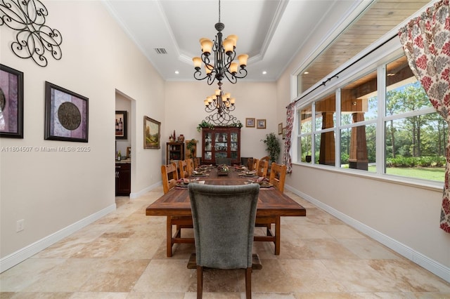3324 Miller Ave, Lake Placid, FL 33852 - dining space with a chandelier, baseboards, a raised ceiling, recessed lighting, and crown molding