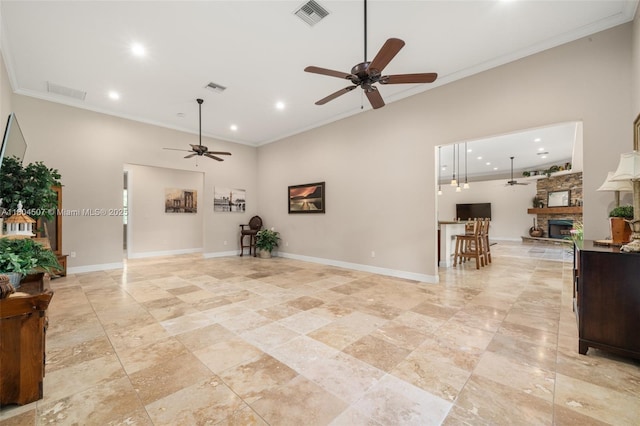 3324 Miller Ave, Lake Placid, FL 33852 - living room with a ceiling fan, high vaulted ceiling, a fireplace, crown molding, and baseboards