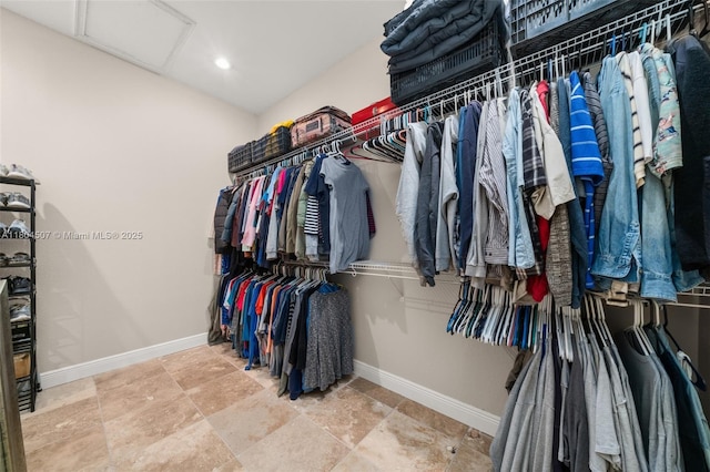 3324 Miller Ave, Lake Placid, FL 33852 - walk in closet with attic access and stone finish floors
