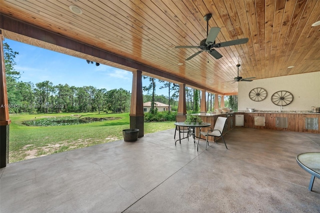 3324 Miller Ave, Lake Placid, FL 33852 - view of patio featuring area for grilling, a ceiling fan, and view of wooded area