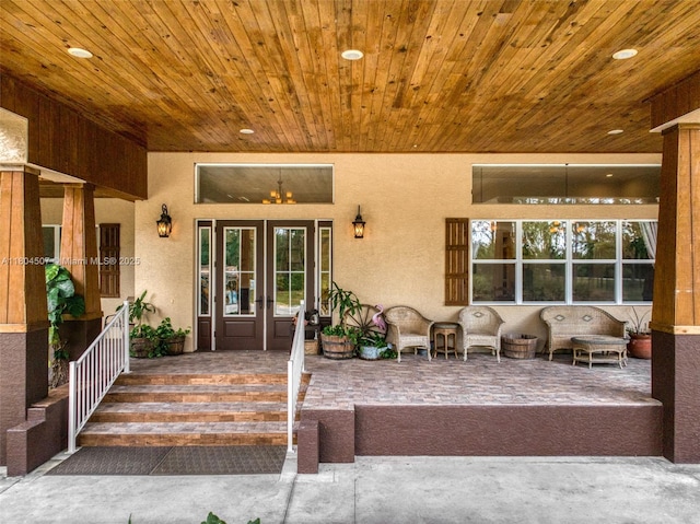 3324 Miller Ave, Lake Placid, FL 33852 - property entrance with stucco siding, covered porch, and french doors