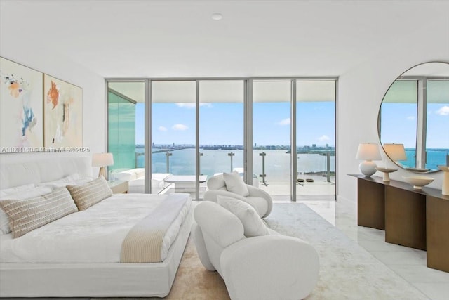 700 NE 26th Ter Unit 3903, Miami, FL 33137 - bedroom with access to exterior, a water view, floor to ceiling windows, light marble finish floors, and multiple windows