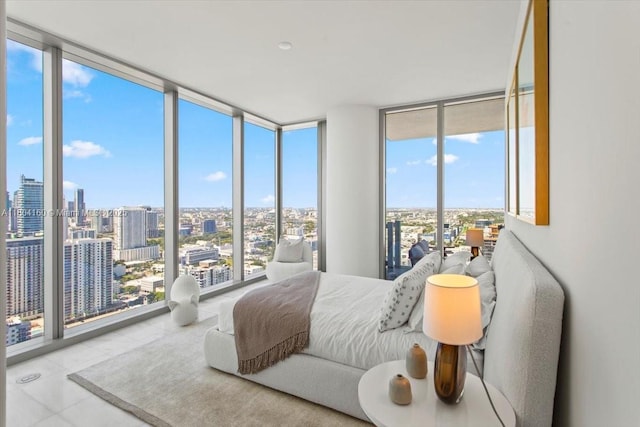 700 NE 26th Ter Unit 3903, Miami, FL 33137 - bedroom featuring expansive windows, a city view, multiple windows, and tile patterned floors