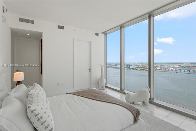 700 NE 26th Ter Unit 3903, Miami, FL 33137 - bedroom featuring floor to ceiling windows and a water view