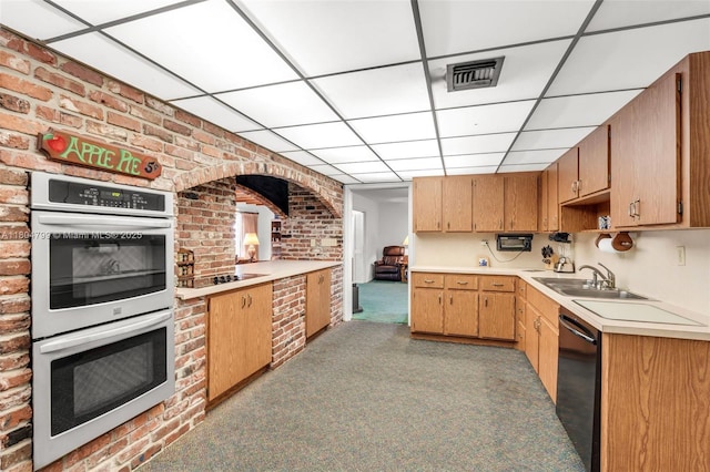 21800 SW 152nd Ave, Miami, FL 33170 - kitchen featuring black appliances, a sink, brick wall, light countertops, and light carpet