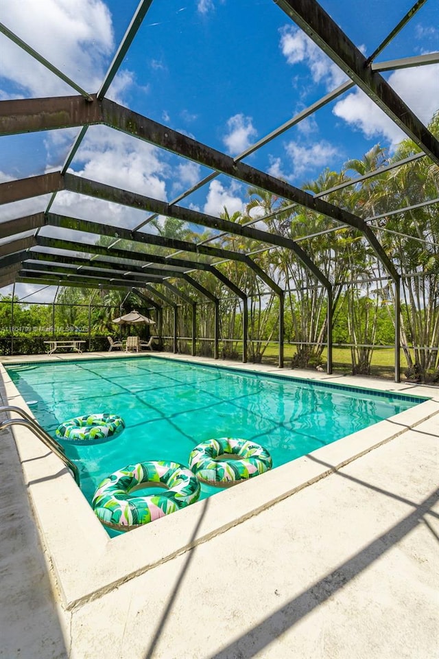 21800 SW 152nd Ave, Miami, FL 33170 - outdoor pool featuring a patio area and a lanai
