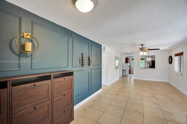 6235 SW 47th Mnr Unit 204, Davie, FL 33314 - bathroom featuring a textured ceiling, tile patterned flooring, ceiling fan, and baseboards