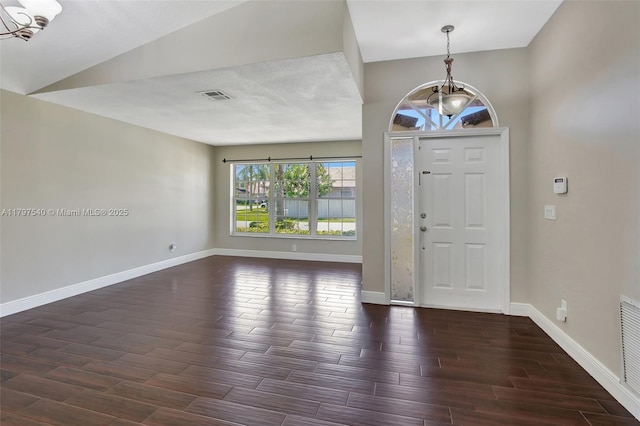 18225 NW 21st St, Pembroke Pines, FL 33029 - foyer featuring a chandelier, dark wood-type flooring, and baseboards