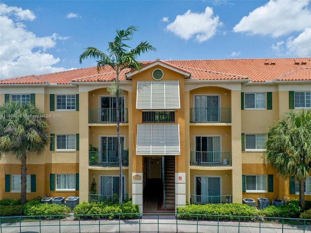 7330 NW 114th Ave Unit 304-5, Doral, FL 33178 - view of building exterior featuring fence and central AC
