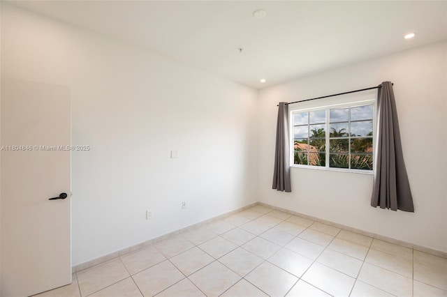 7330 NW 114th Ave Unit 304-5, Doral, FL 33178 - spare room with recessed lighting and light tile patterned floors
