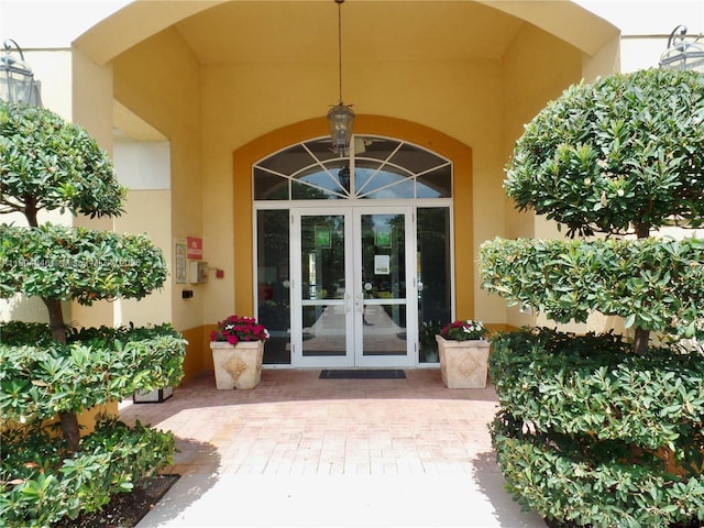 7330 NW 114th Ave Unit 304-5, Doral, FL 33178 - property entrance featuring french doors and stucco siding