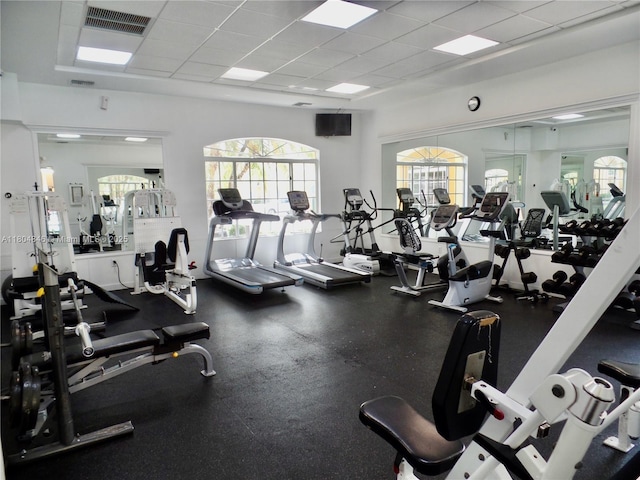7330 NW 114th Ave Unit 304-5, Doral, FL 33178 - exercise room featuring a paneled ceiling and plenty of natural light