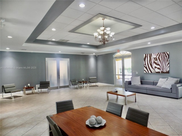 7330 NW 114th Ave Unit 304-5, Doral, FL 33178 - dining space featuring french doors, a tray ceiling, tile patterned floors, a chandelier, and baseboards