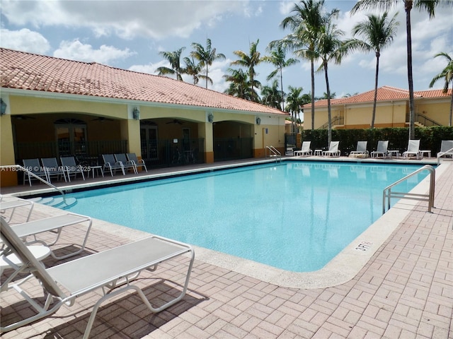 7330 NW 114th Ave Unit 304-5, Doral, FL 33178 - community pool with ceiling fan, a patio, and fence